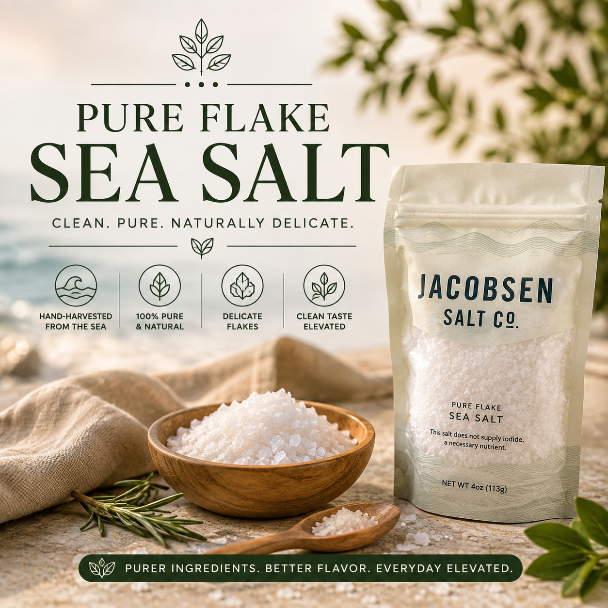 Pure Flake Sea Salt collection banner featuring Jacobsen Pure Flake Sea Salt with flaky sea salt in a wooden bowl, rustic spoon, linen cloth, fresh rosemary, and a clean coastal-inspired background with natural botanical accents.