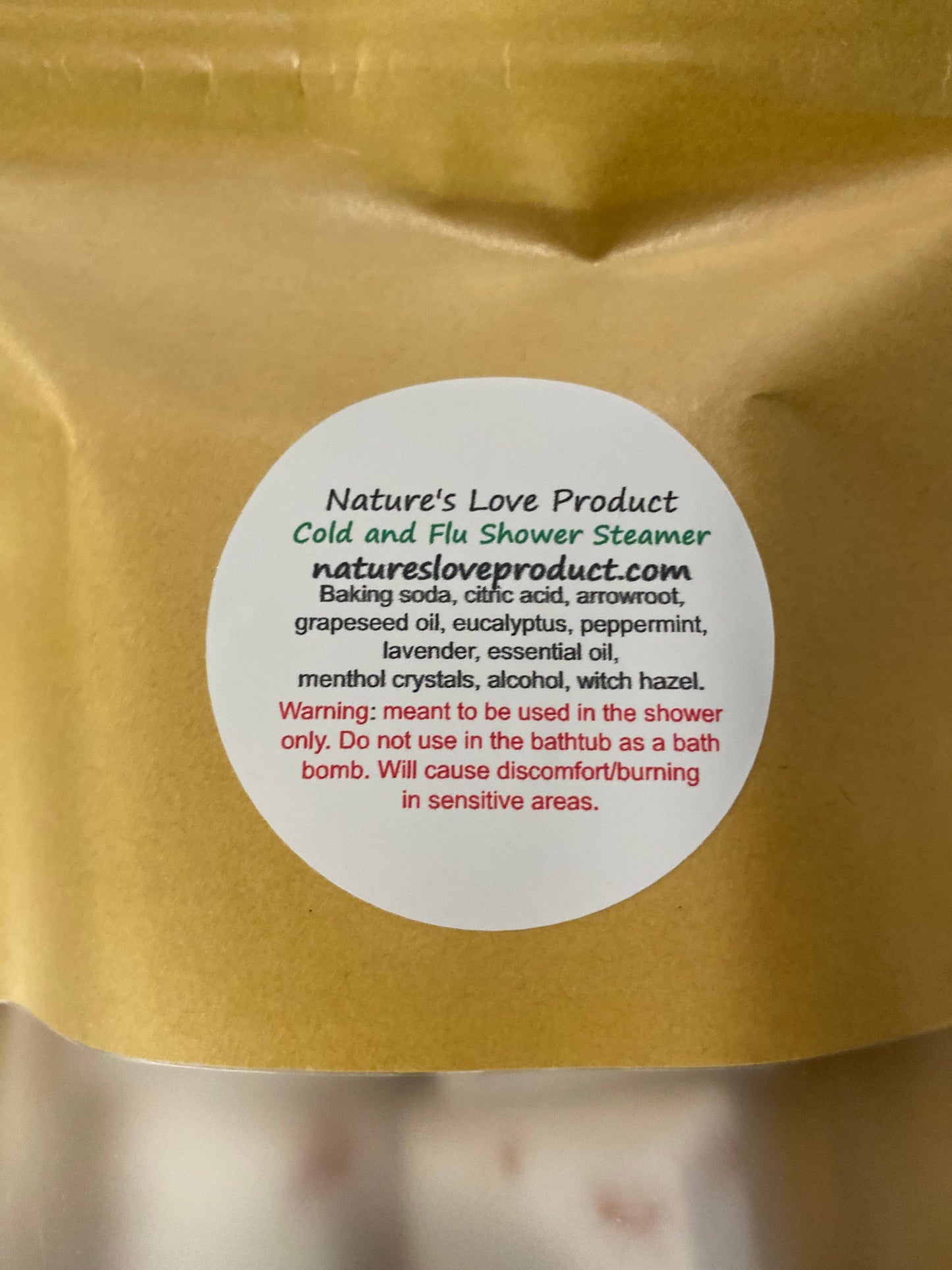 Yellow package with a label for 'Nature's Love Product' shower steamer.