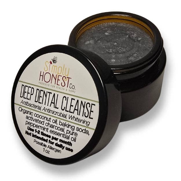 Black container of 'Simply Honest Co.' Deep Dental Cleanse with open lid on a white background