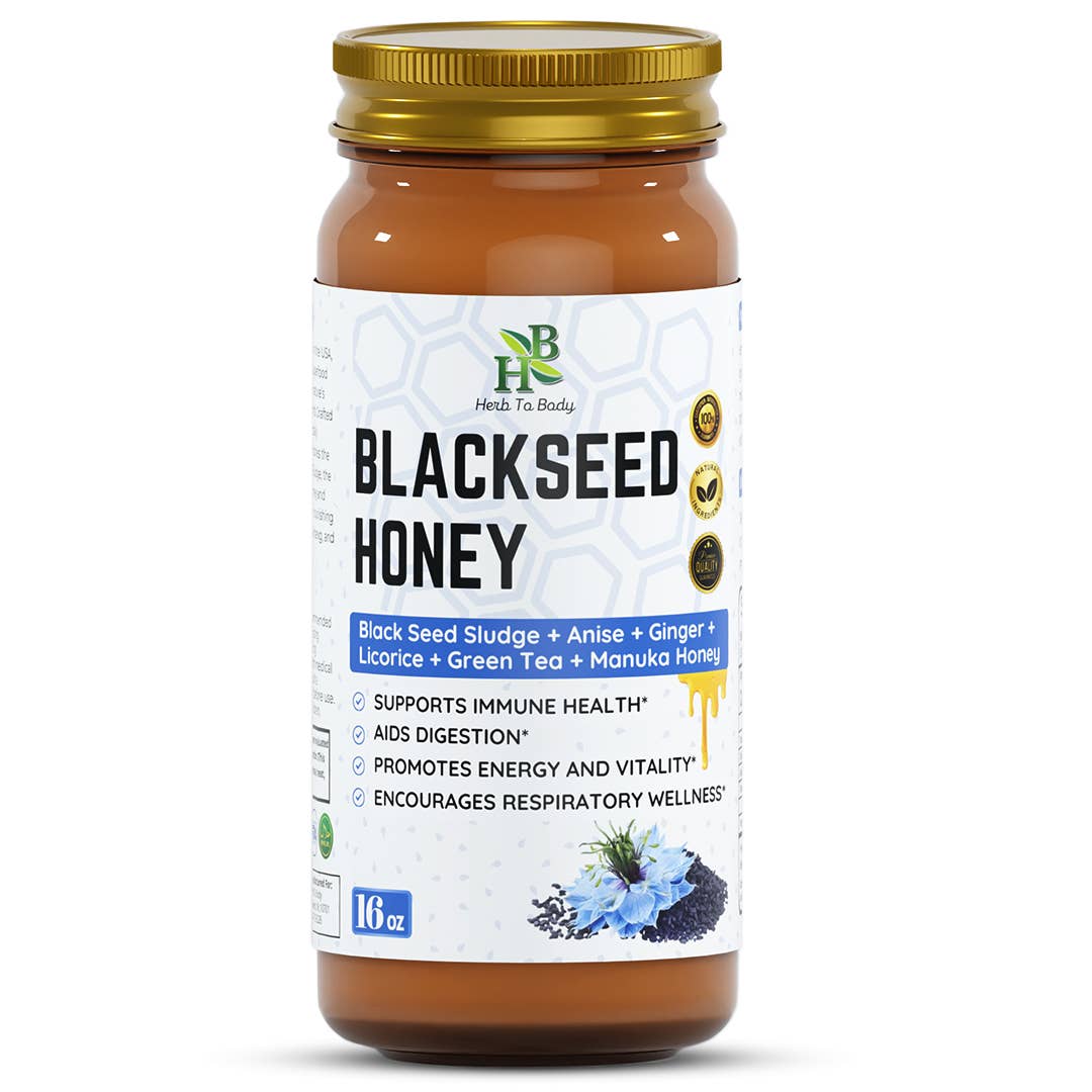 Jar of blackseed honey with a gold lid on a white background