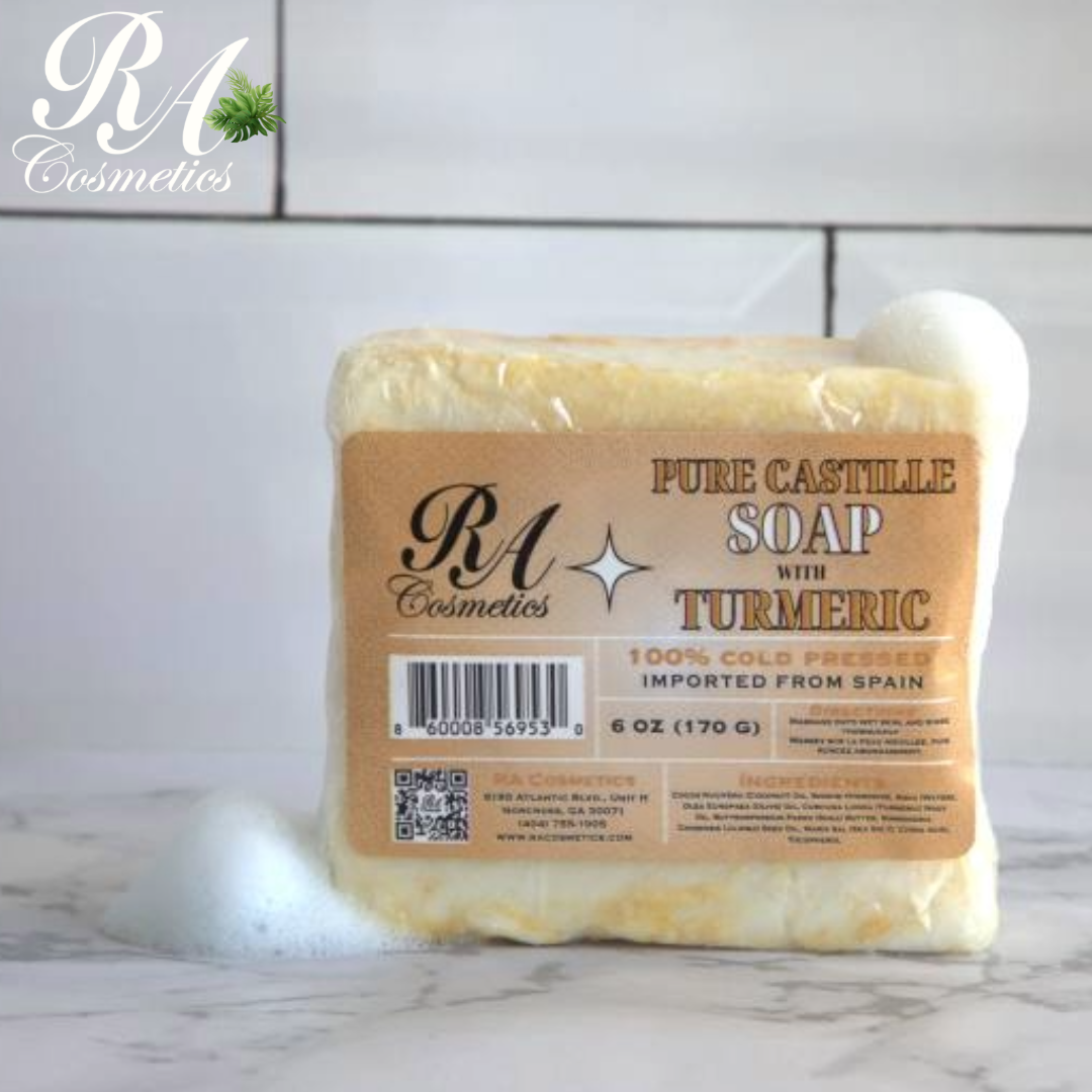  Pure Castille Soap with Turmeric on a marble surface with a white tiled wall background.