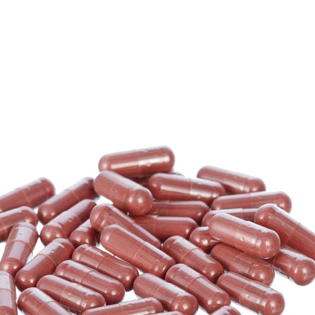 Red capsules on a white background