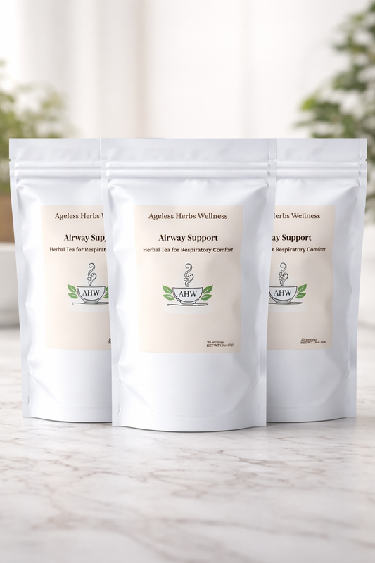 Three packages of Ageless Herbs Wellness on a light wooden surface with a blurred natural background. Airway Support herbal tea with mullein and Thyme for respiratory health